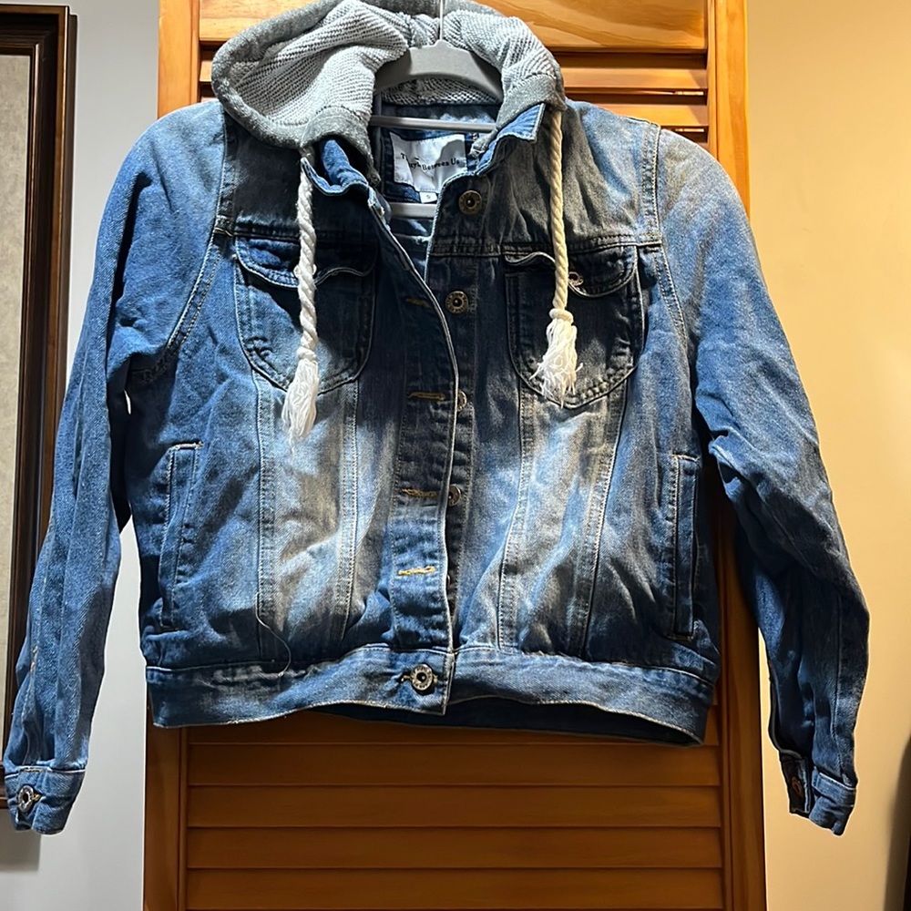 Jean Jacket Size small with pull strings and Side pockets.